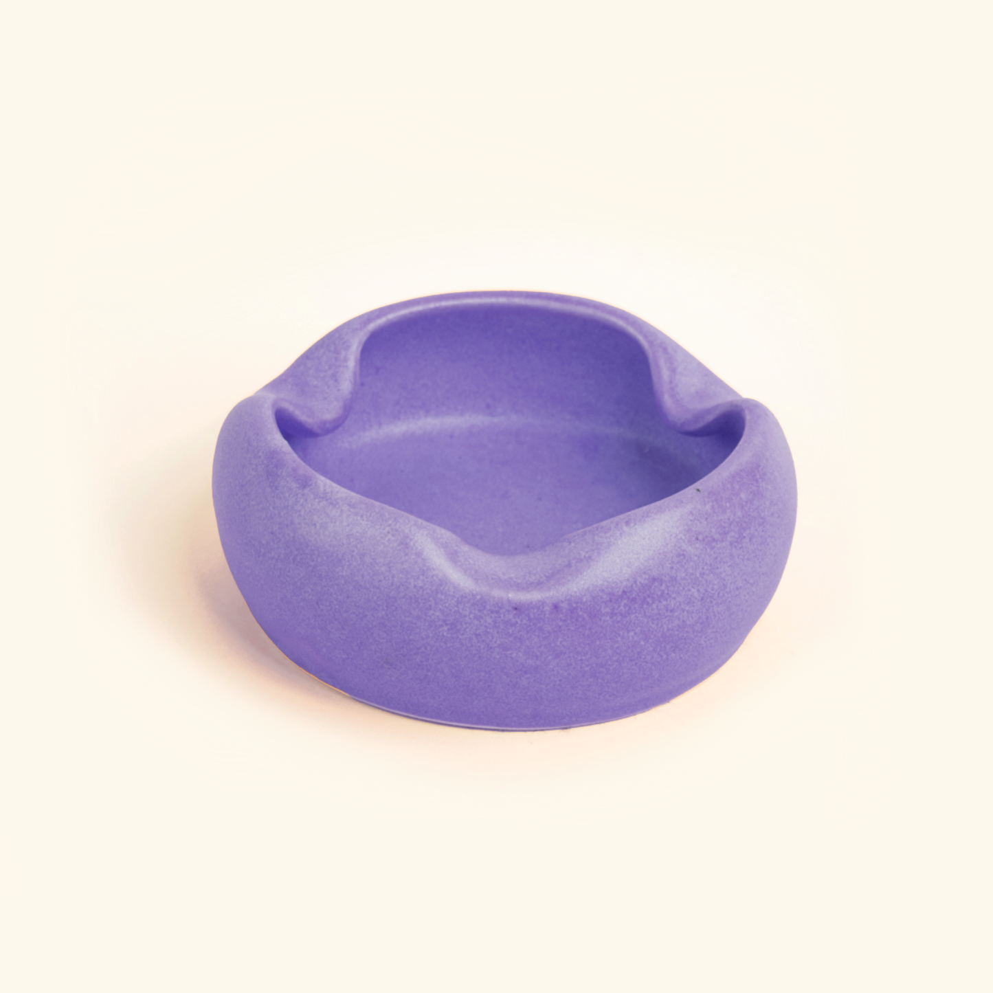 Purple ceramic bowl on a white background